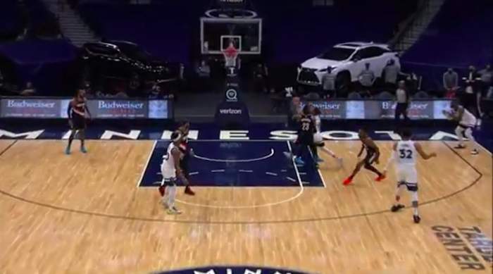 Damian Lillard is behind Robert Covington and Ricky Rubio. He's moving, but he's not all that close to the restricted area.